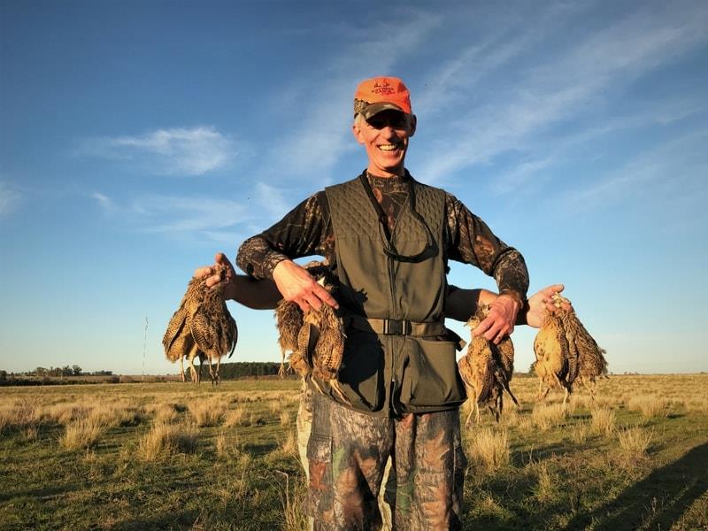 A1 Decoy Ltd dove shooting trip in Argentina, featuring hunters with shotguns and flying doves in a natural outdoor setting.