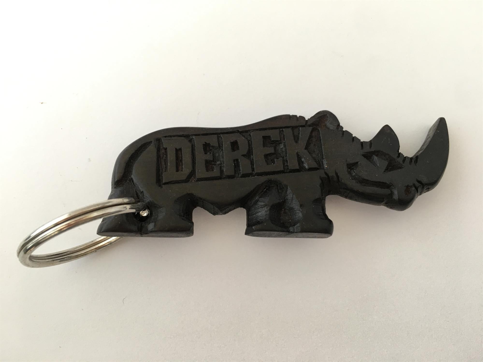Hand-carved zebra key ring by A1 Decoy Ltd, detailed wooden keychain featuring intricate zebra design.