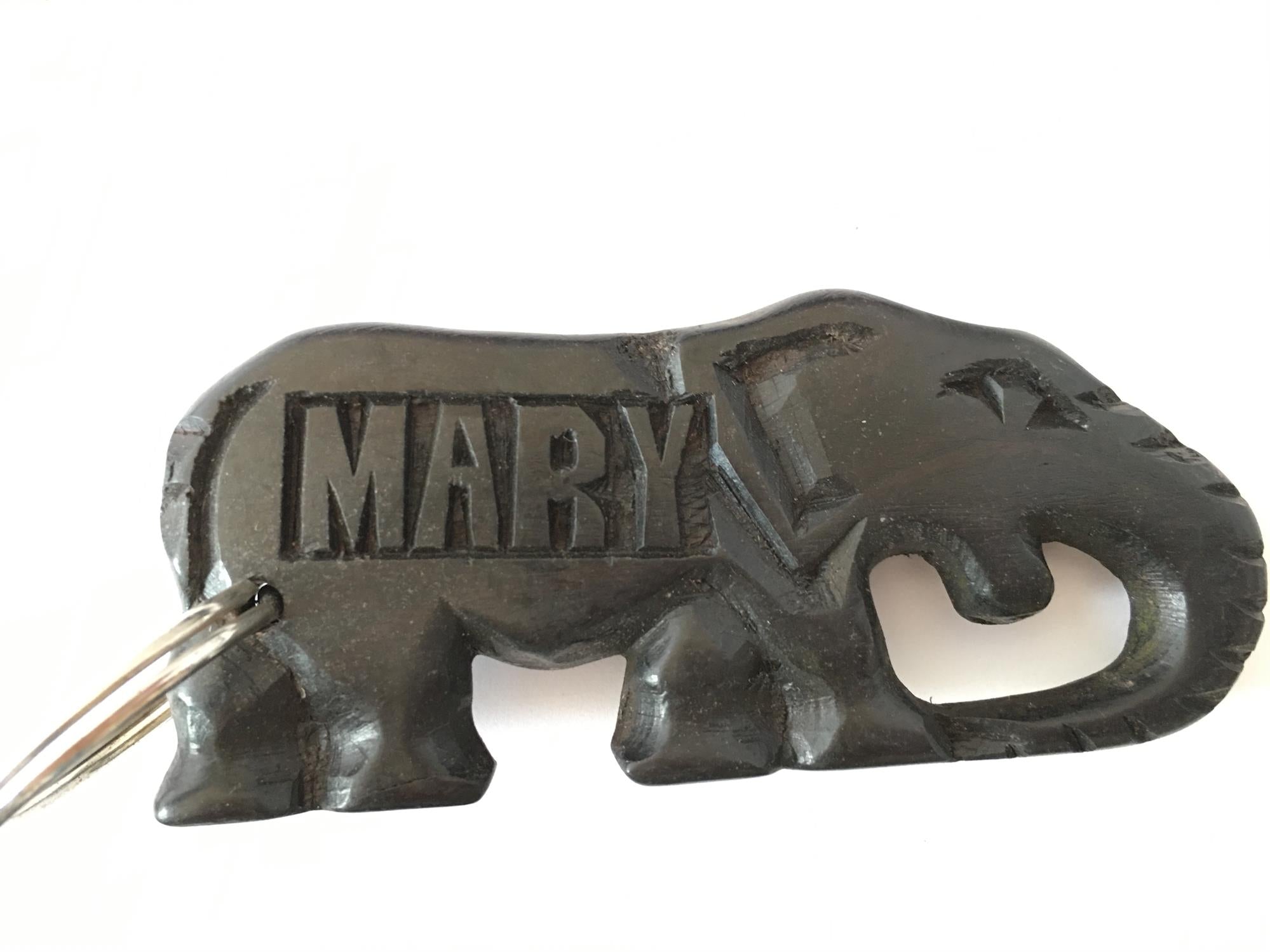 Hand-carved zebra key rings from A1 Decoy Ltd, featuring detailed animal designs on durable metal keychains.