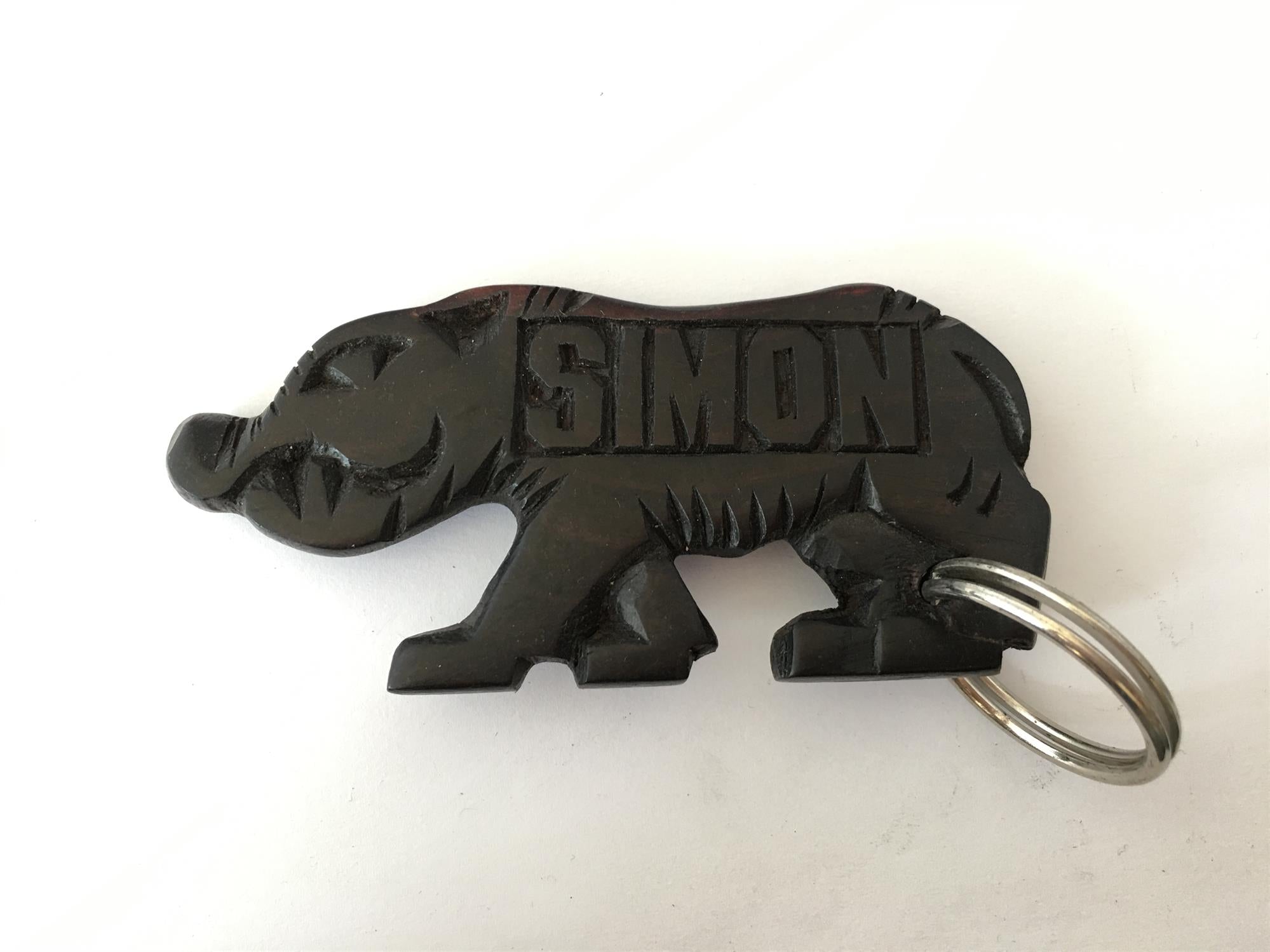 Hand-carved zebra key ring from A1 Decoy Ltd, detailed wooden keychain with intricate zebra design.