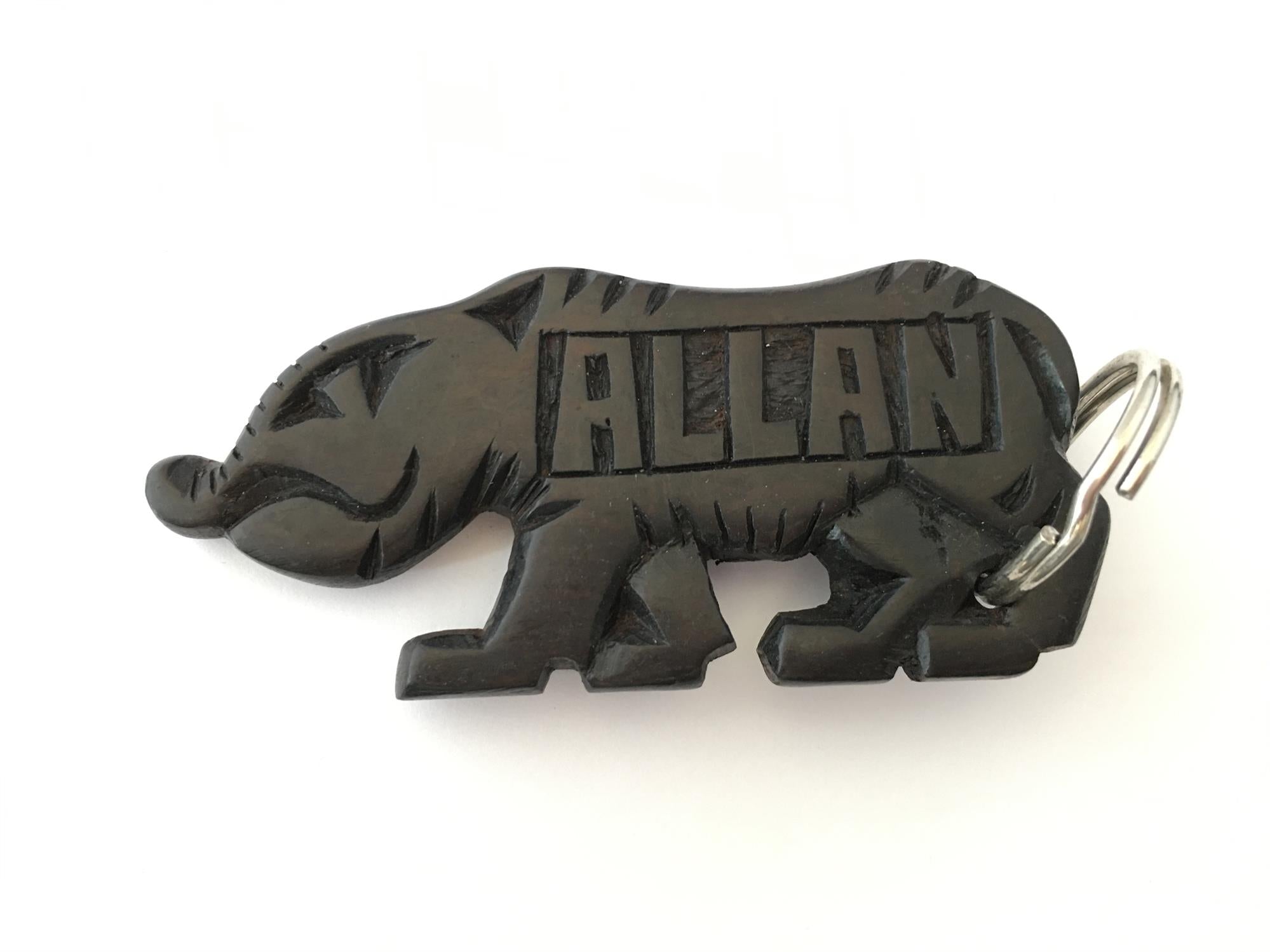 Hand-carved zebra key ring by A1 Decoy Ltd, featuring detailed animal design on carved wooden keychain.