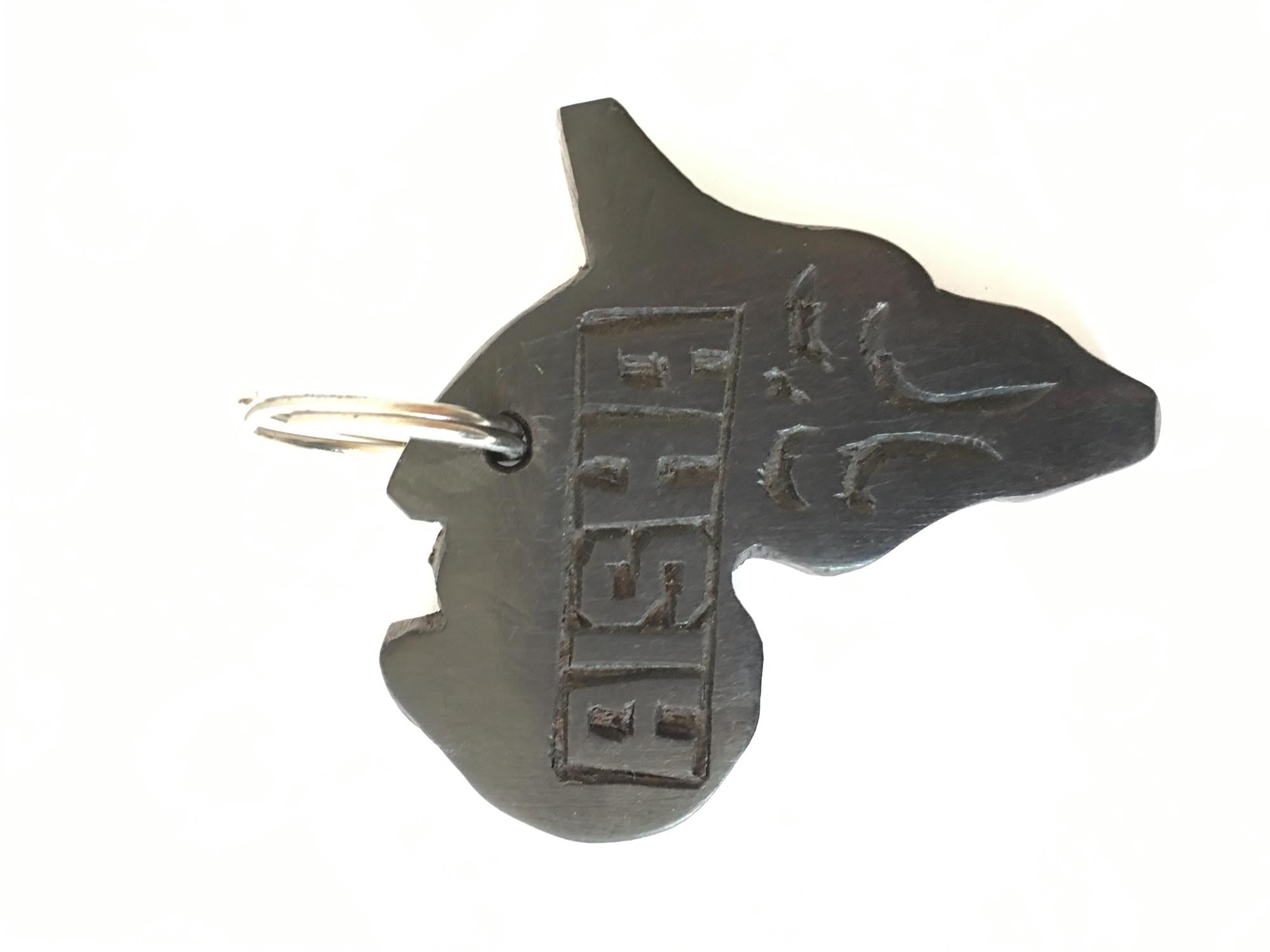 Hand-carved zebra key ring by A1 Decoy Ltd, featuring detailed animal design on a small wooden keychain.