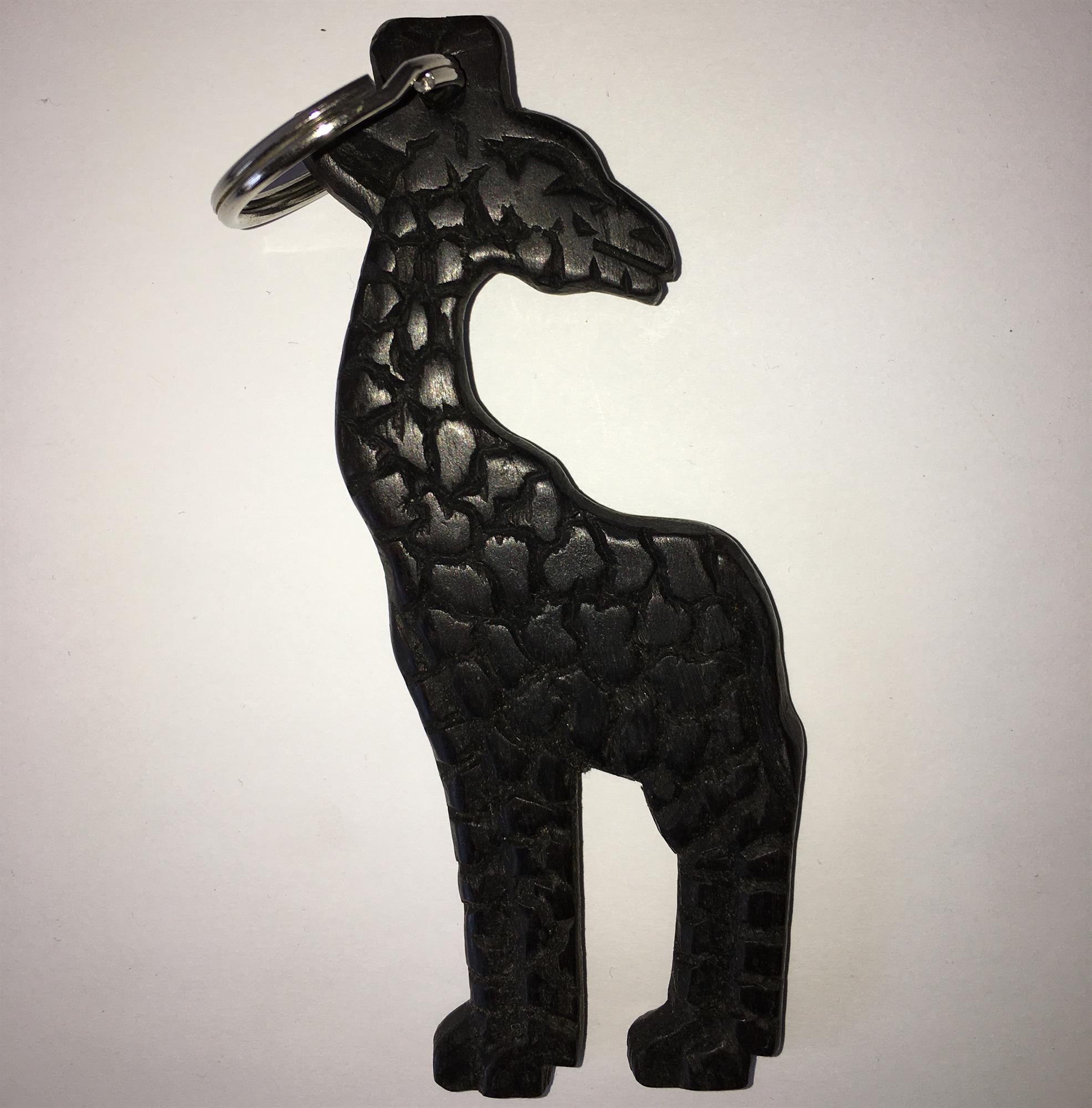 Hand-carved zebra key ring by A1 Decoy Ltd featuring detailed animal design on a metal keychain.