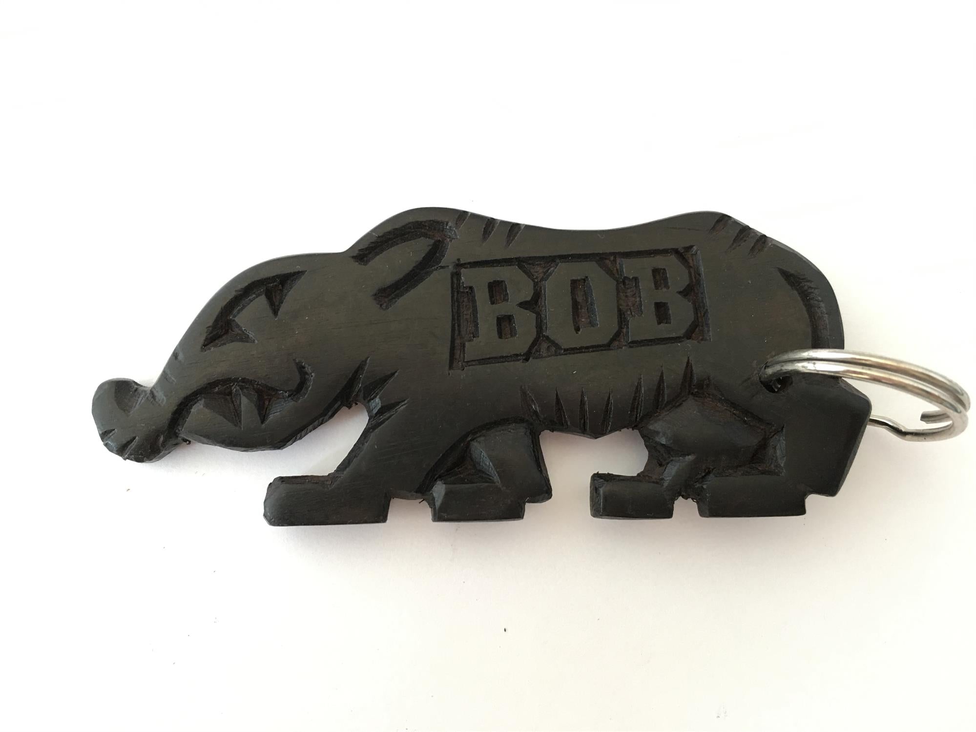 Hand-carved zebra key ring by A1 DECOY LTD featuring detailed animal design on a metal keyring.