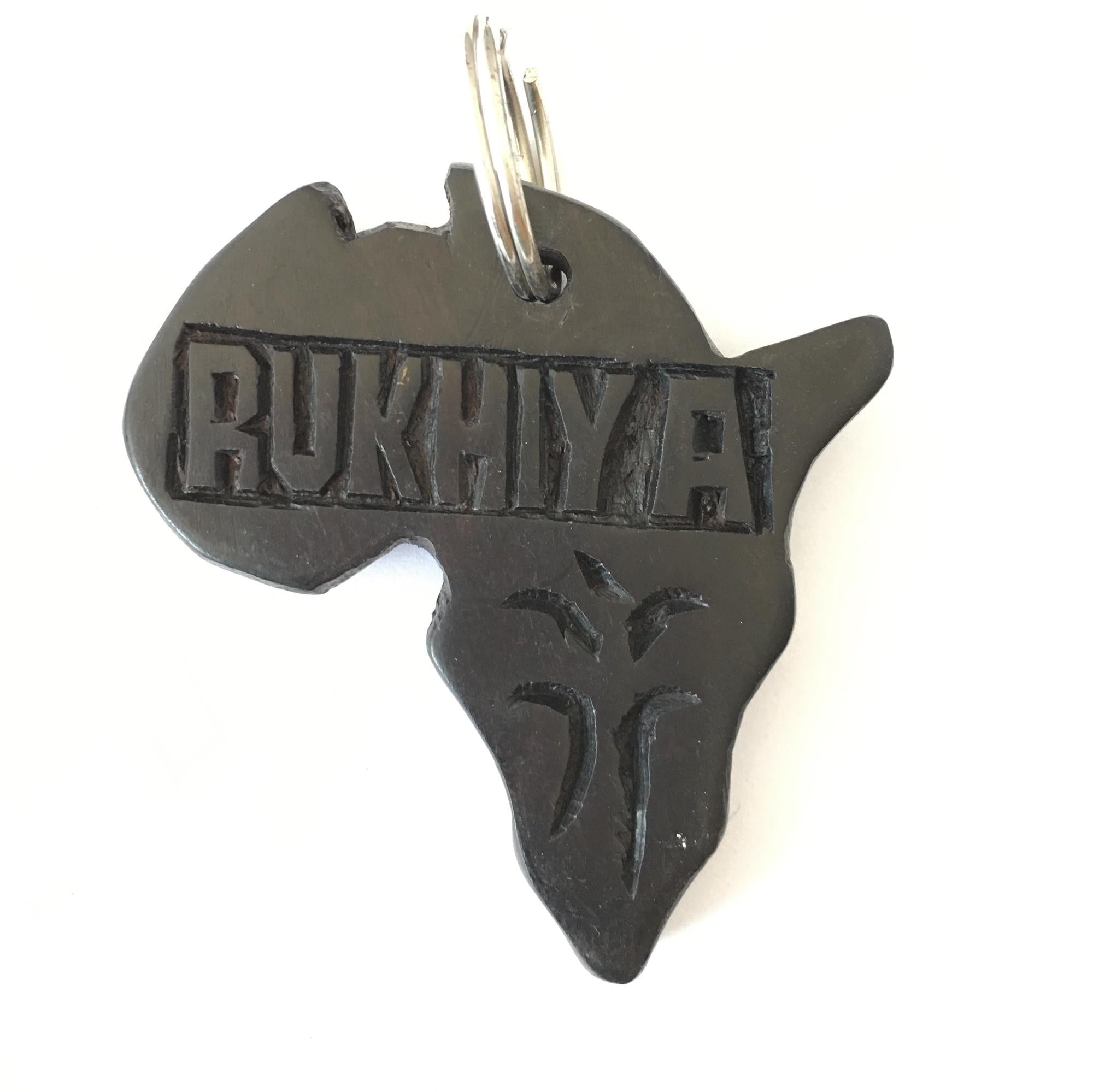 Hand-carved zebra key ring by A1 DECOY LTD featuring detailed animal design and natural wood finish.