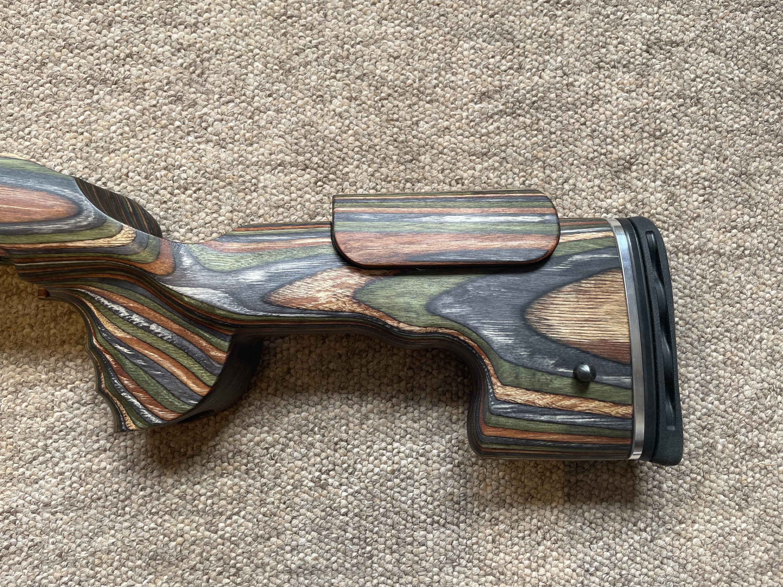 HIGHLAND GRS Sporter Standard Action rifle with Green Mountain Camo finish, designed for Blaser R8 model, displayed outdoors.