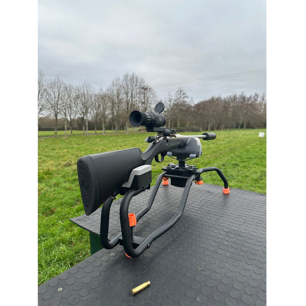 Heavy-duty adjustable ambidextrous gun rest by ECHO, featuring a sturdy design and padded support for secure firearm placement.