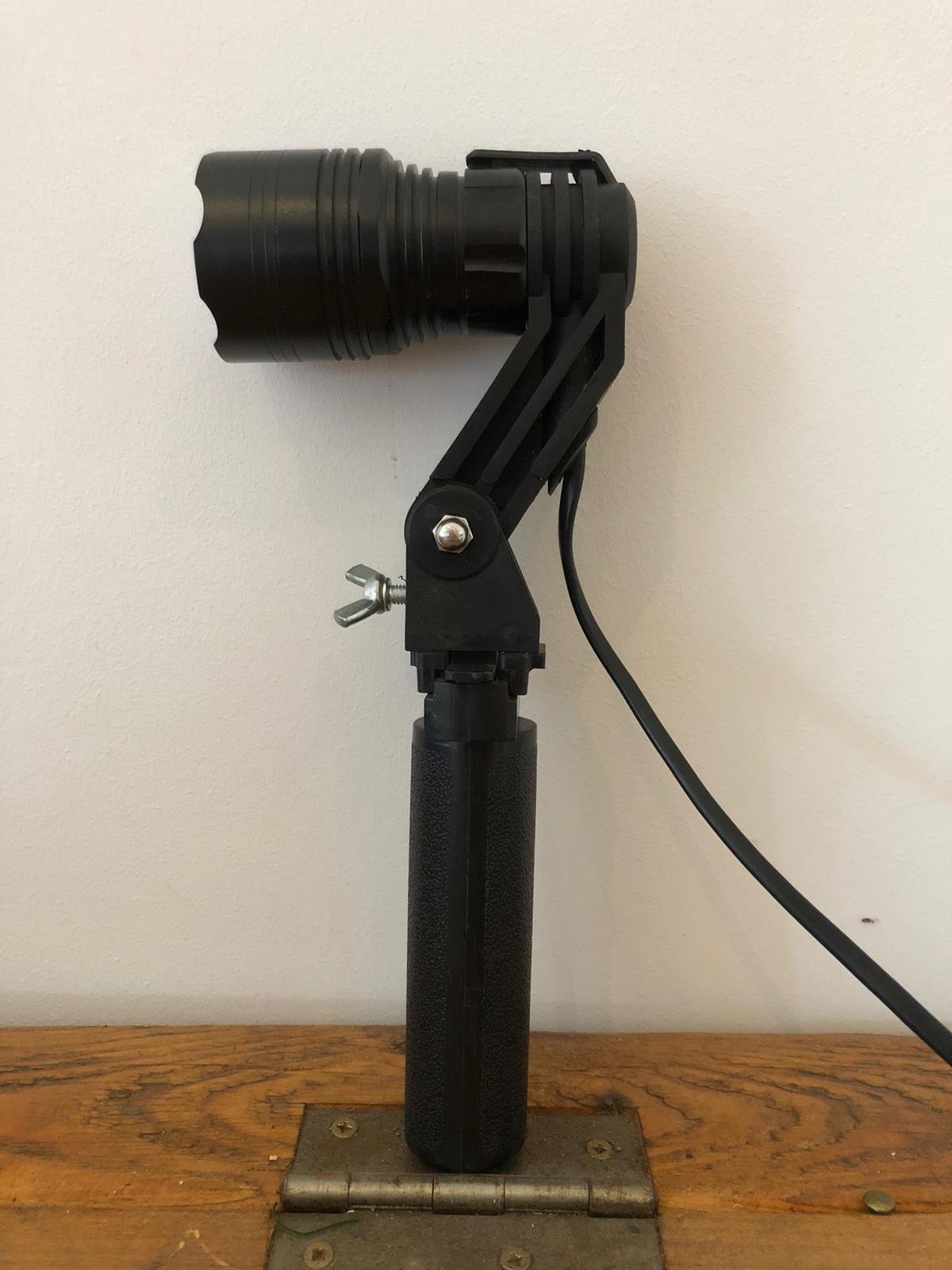 A1 Decoy LED handheld and scope-mounted lamp with 300m beam distance, black design, and adjustable focus for outdoor use.