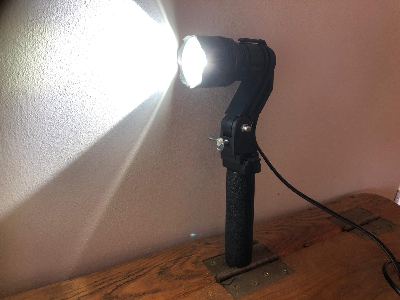 A1 Decoy LED handheld and scope-mounted lamp with 300m beam distance, compact design, and adjustable focus for outdoor use.
