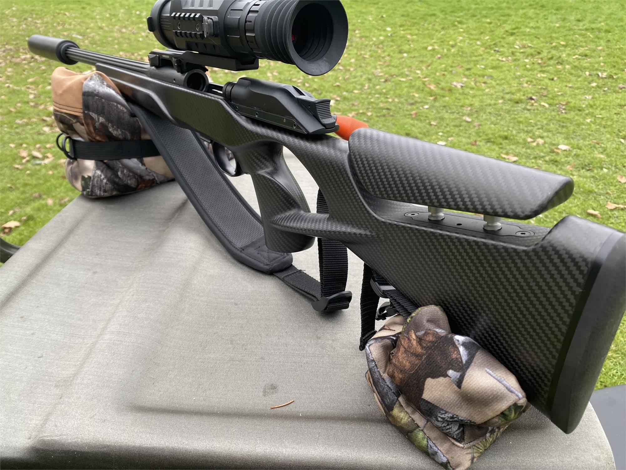 Camo two-piece rifle rest set by A1 Decoy Ltd with unfilled camouflage fabric and adjustable support for firearm stability.