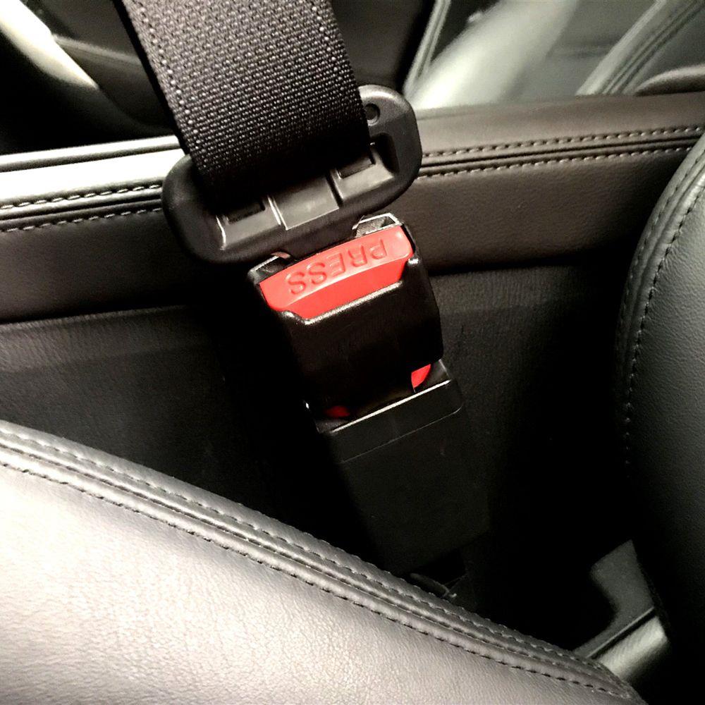 Car seat belt buckle extender from AliExpress, showing the metal latch and fabric strap for easier seat belt fastening.
