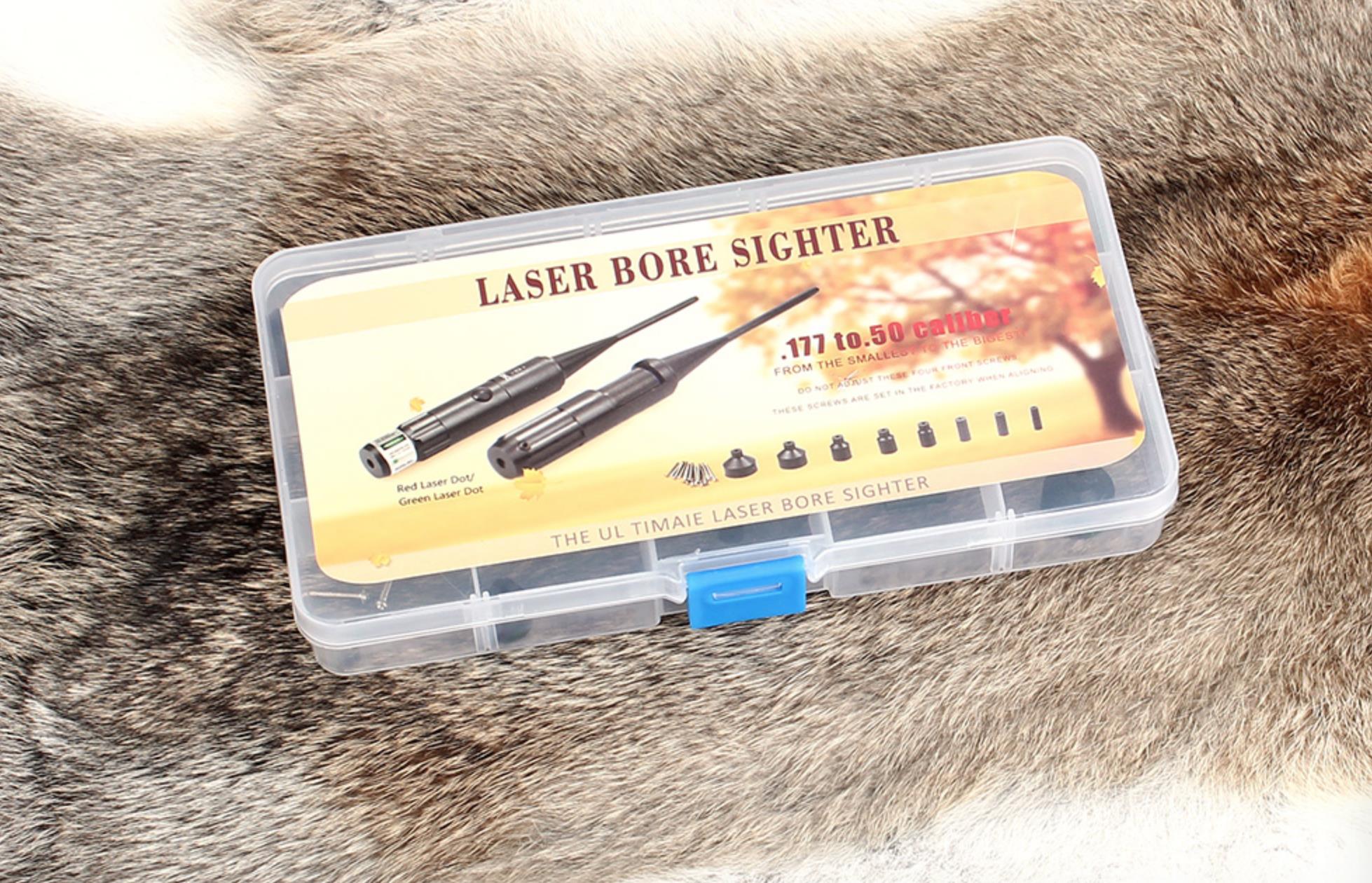 Red and green laser bore sighter for .17 to .50 caliber rifles and 12G/20G shotguns, aiding firearm sight alignment.