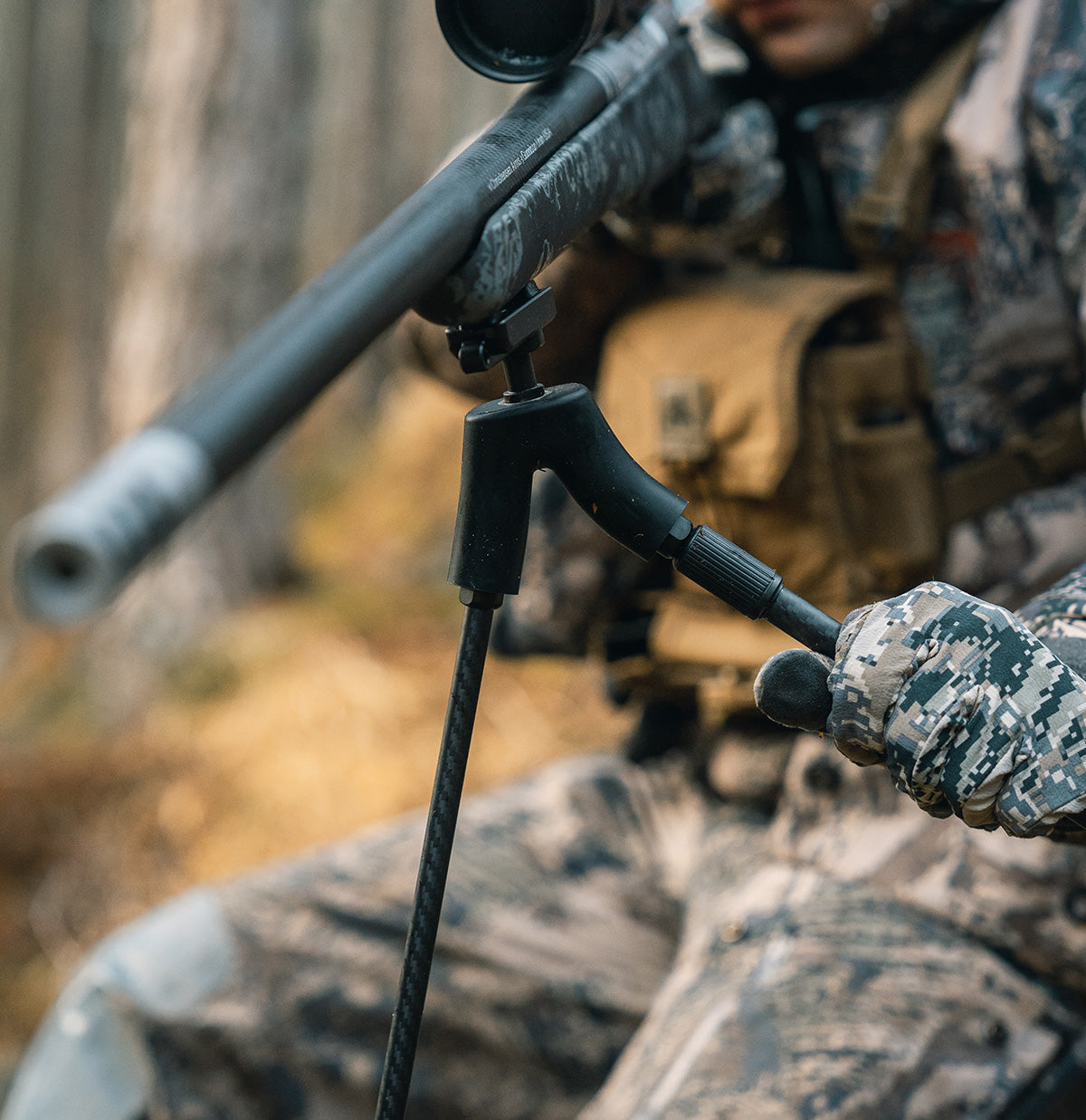 ELITE Spartan Springbok bipod mounted on a firearm, showcasing its sturdy design and adjustable legs for stable shooting support.