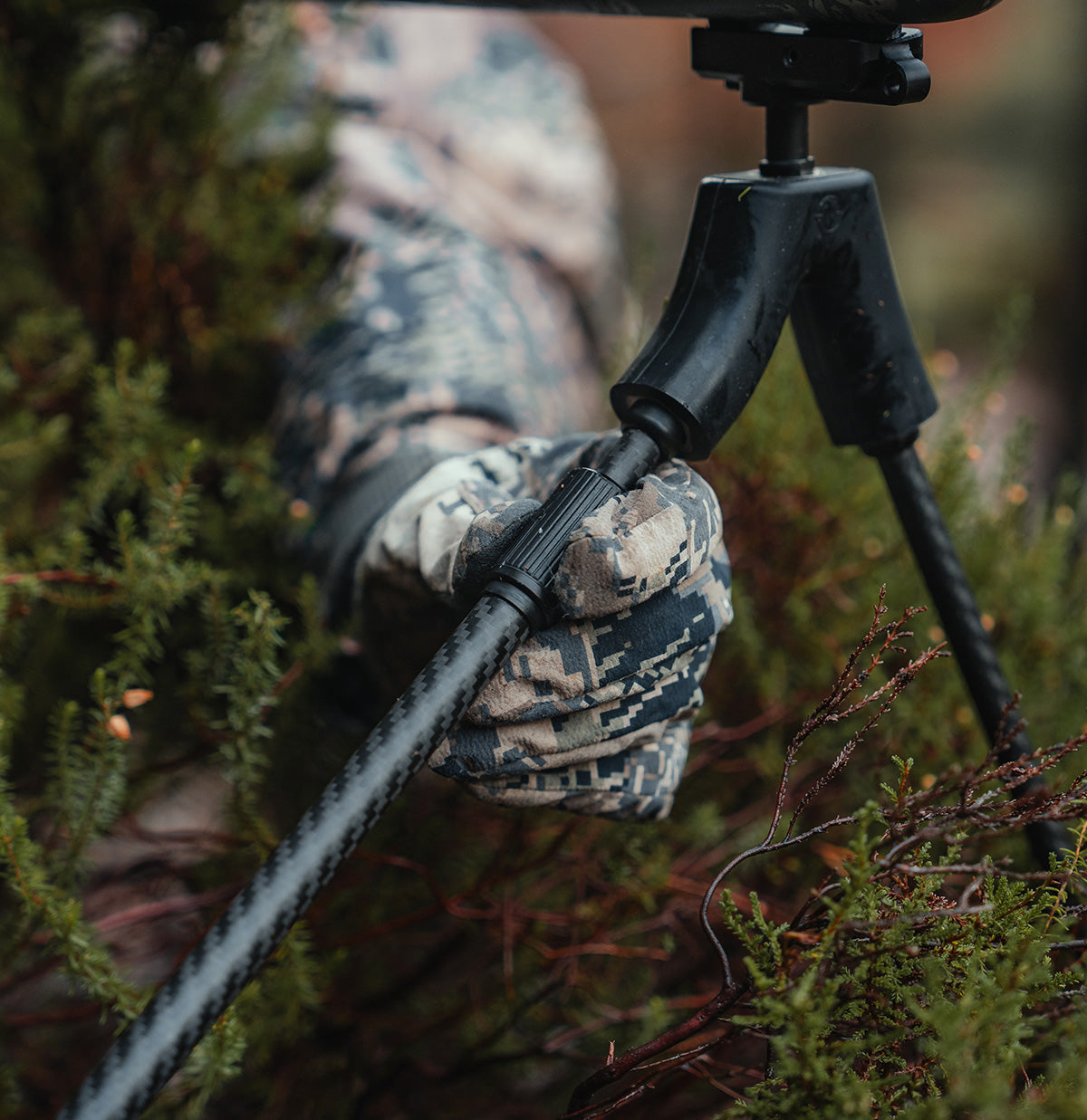ELITE Spartan Springbok Bipod mounted on a rifle, showing adjustable legs and sturdy construction for stable shooting support.