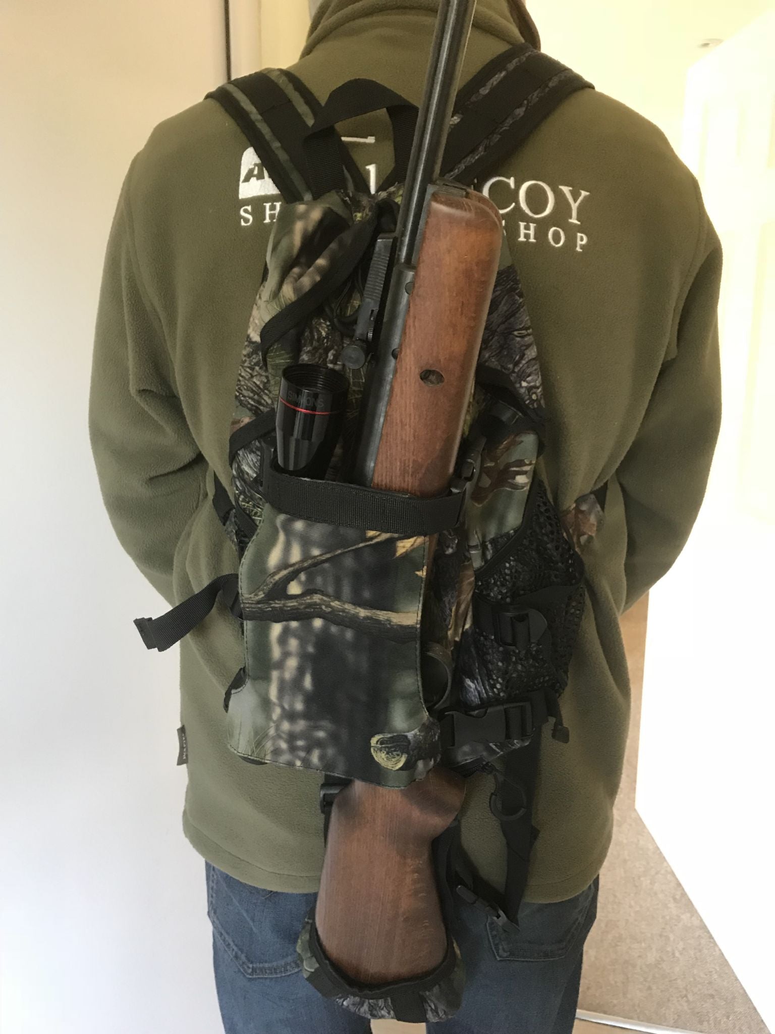 Simon backpack rifle holder with adjustable straps and padded interior for secure outdoor firearm transport.