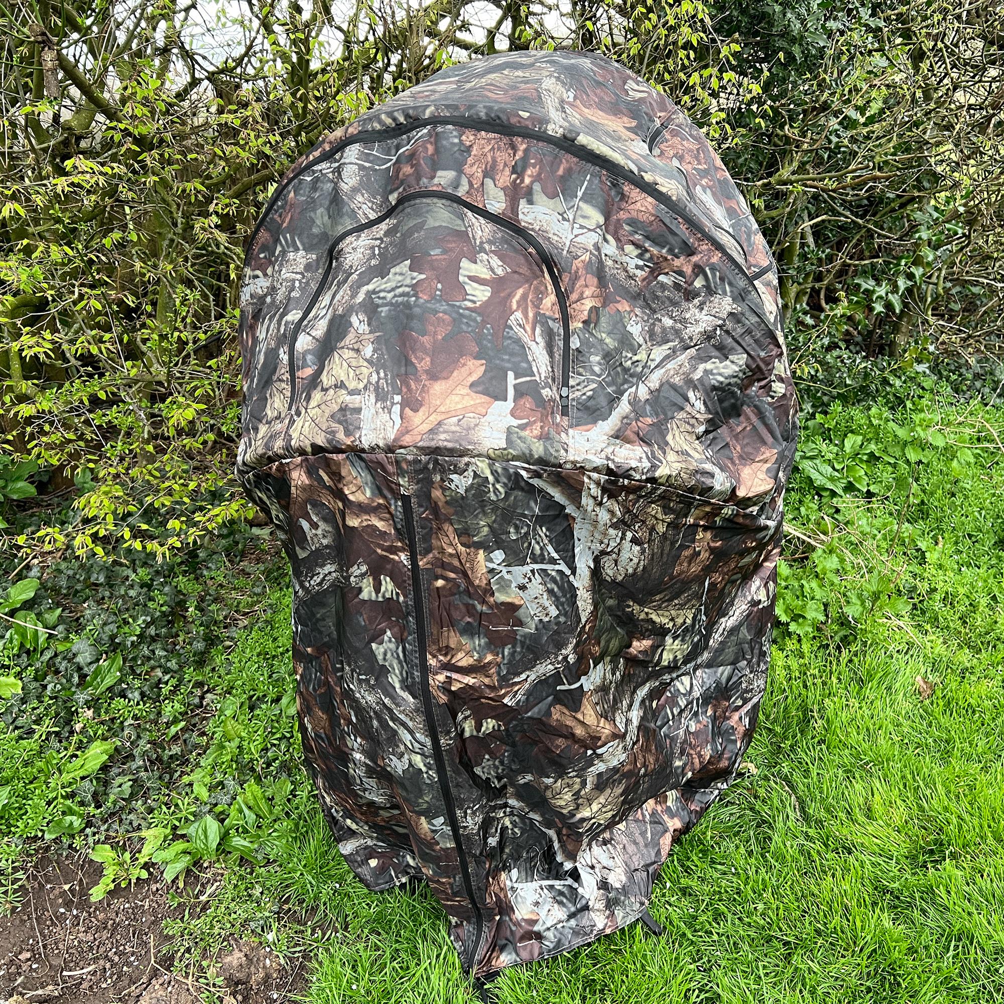 Portable Dale 1-man pop-up hide tent set up outdoors, made of durable fabric for hunting or wildlife observation.