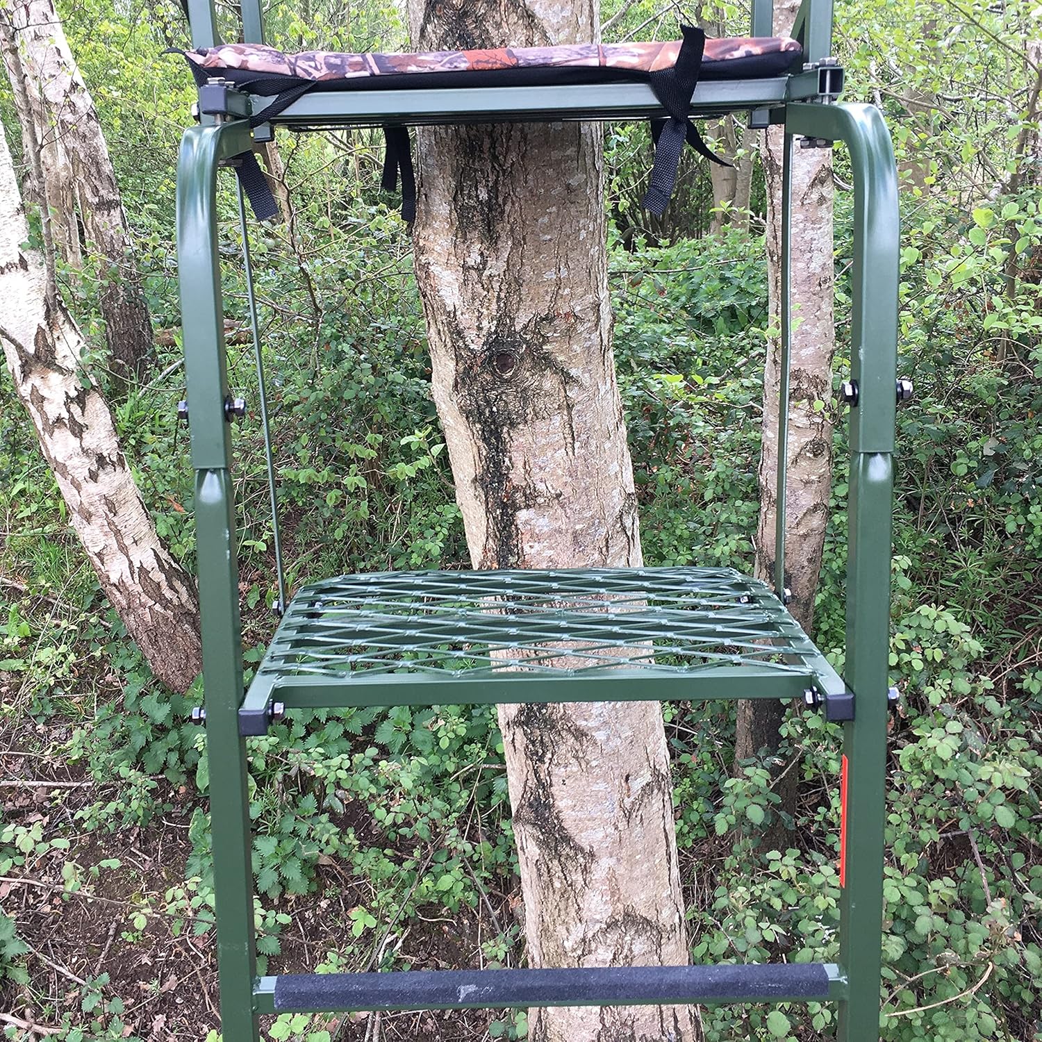 Galvanized adjustable high-seat hunting tree stand from DALE, featuring a sturdy frame and secure platform for outdoor wildlife observation.