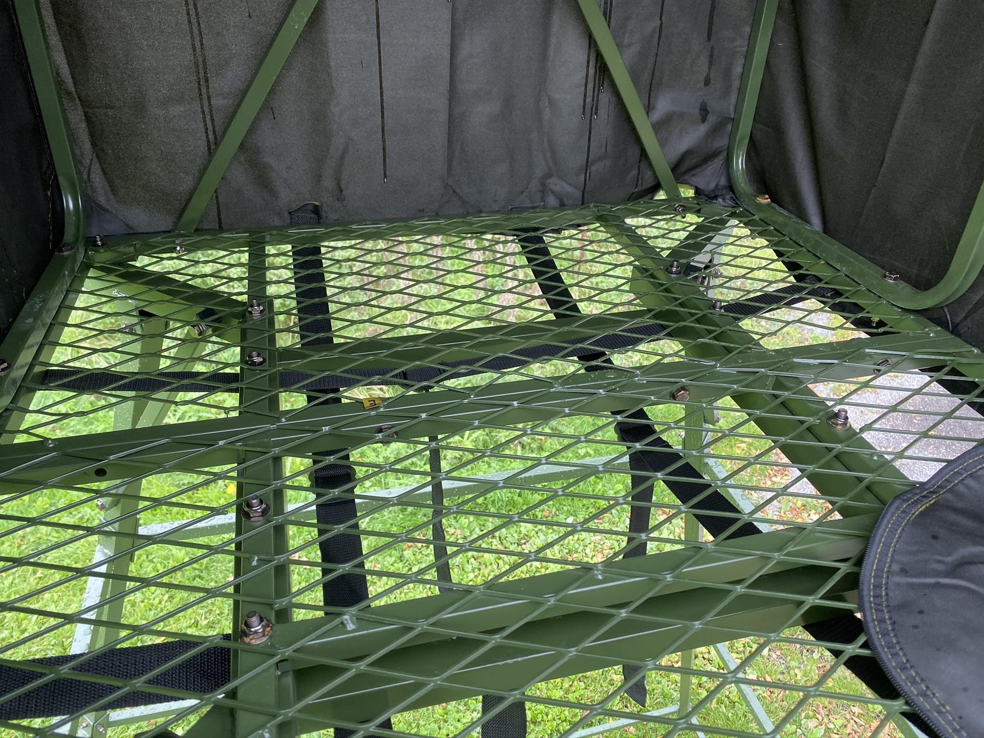 DALE covered double free-standing high seat enclosed hunting tower with water-resistant cover, ideal for elevated outdoor hunting.