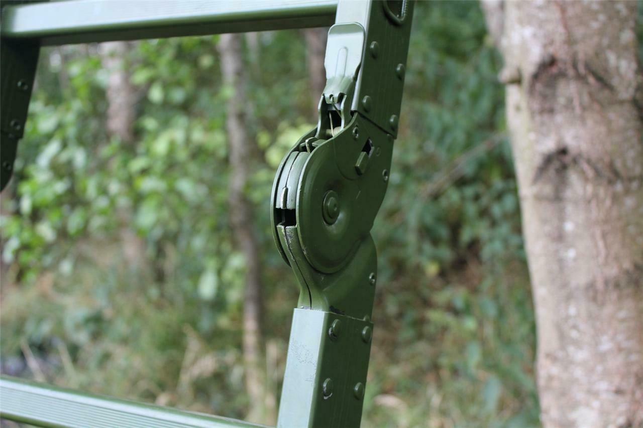 Folding high seat by DALE, showing a compact, portable baby booster seat with foldable design and safety straps.
