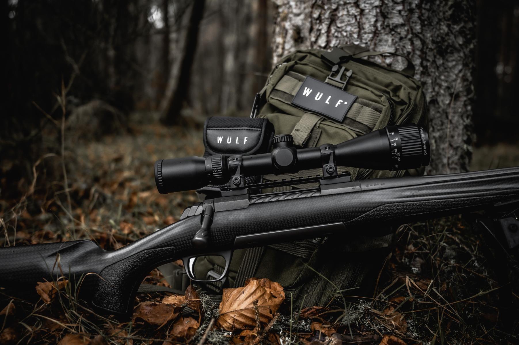 ELITE WULF Fireball 4-12x50 rifle scope with free dovetail mounts, featuring adjustable zoom and lens for precise targeting.
