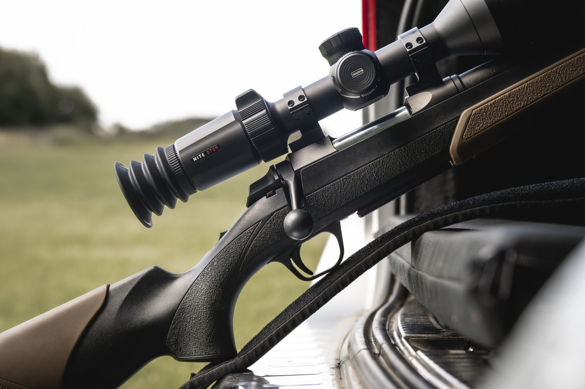 Hawke NocPix NITE D70R 4K digital rifle scope with day/night vision and laser rangefinder mounted on a rifle.