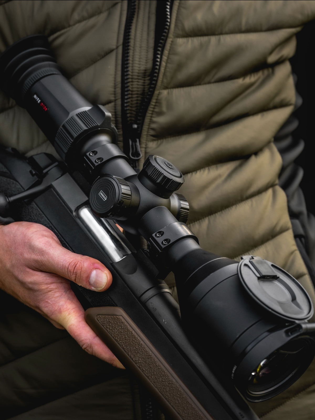 Hawke NocPix NITE D70R 4K digital rifle scope with day/night vision and laser rangefinder for precise targeting.
