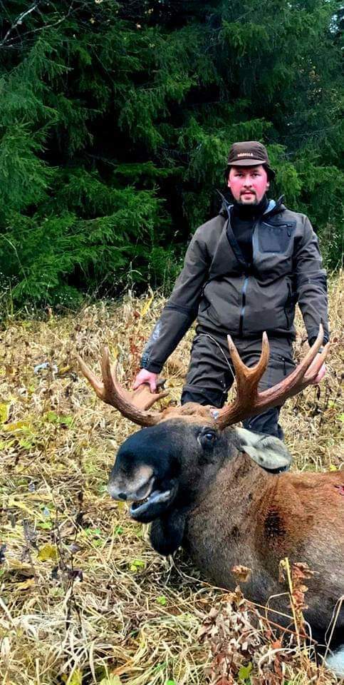 Siberian Moose hunting trip in Russia with A1 DECOY LTD, featuring a scenic landscape and moose silhouette in the wilderness.