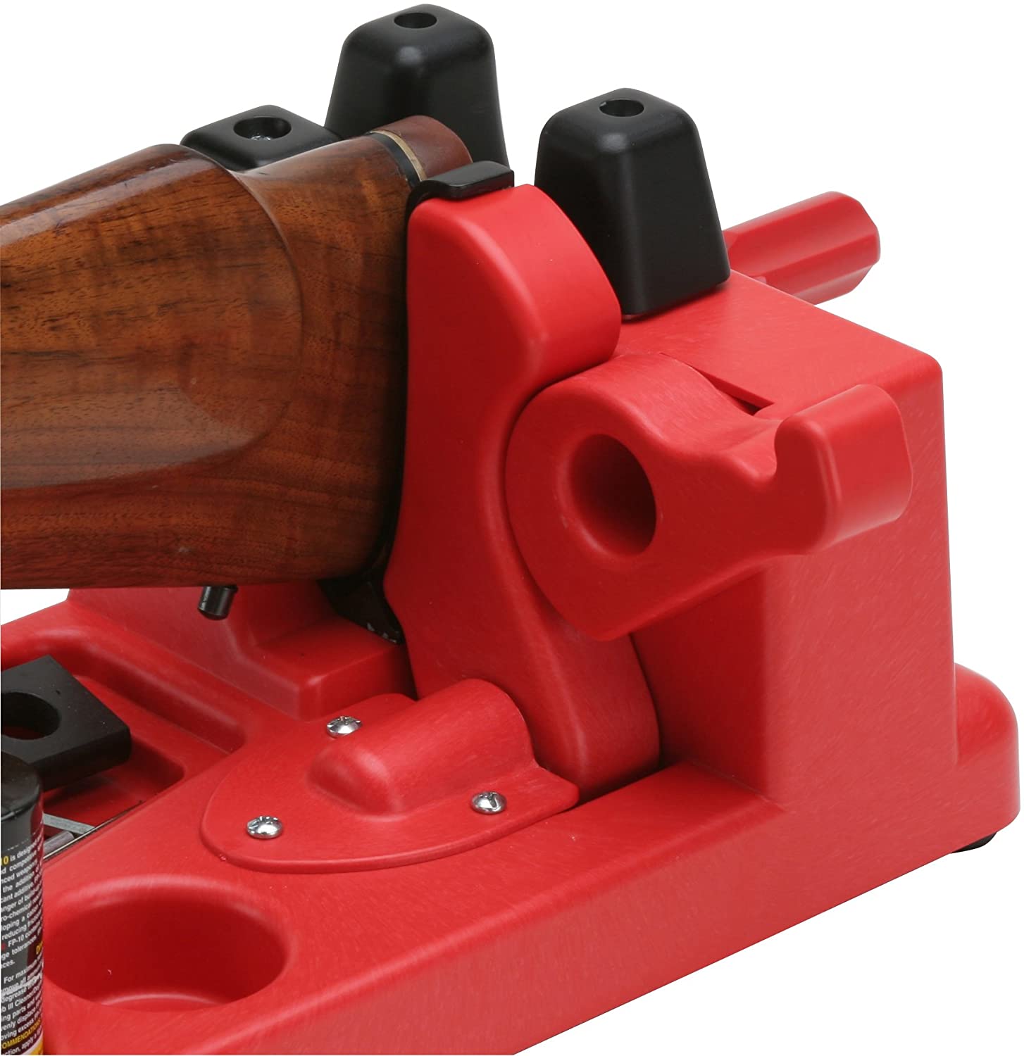 Rothery MTM gun vice mounted on workbench for firearm maintenance and handling, with adjustable clamps and sturdy metal construction.