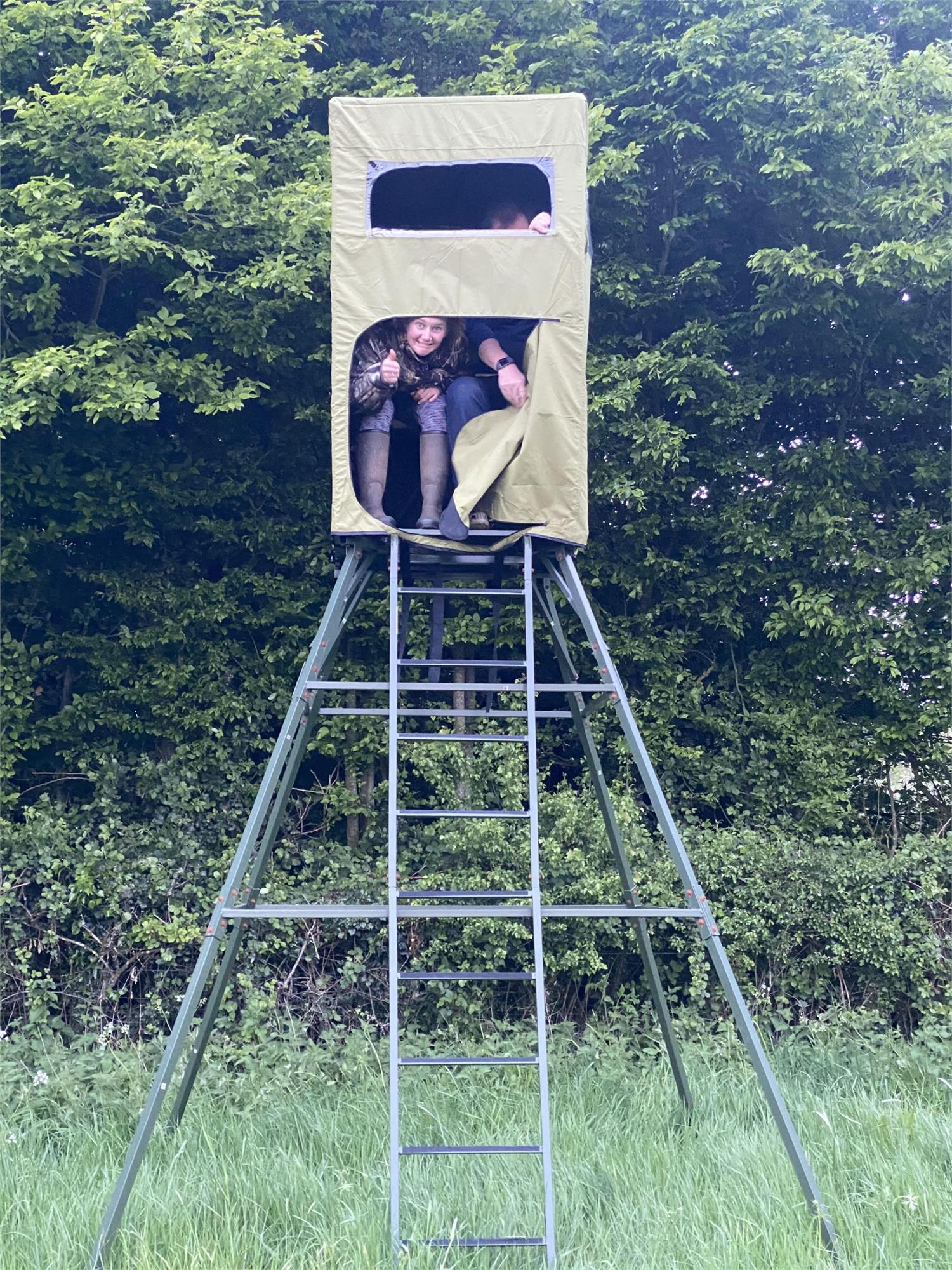 Covered double free-standing high seat hunting tower by DALE with water-resistant cover and enclosed design for outdoor wildlife observation.