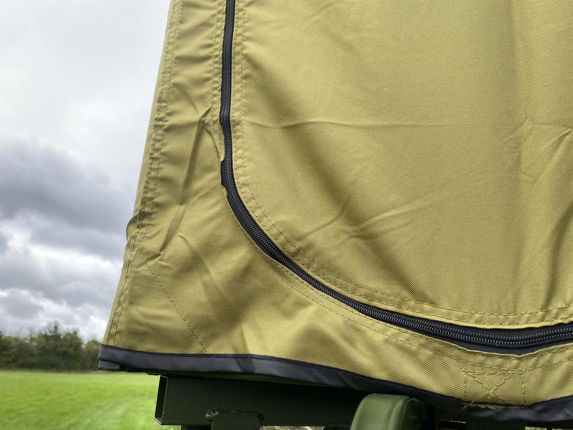 DALE covered double free-standing high seat hunting tower with water-resistant cover, enclosed and elevated for hunting use.
