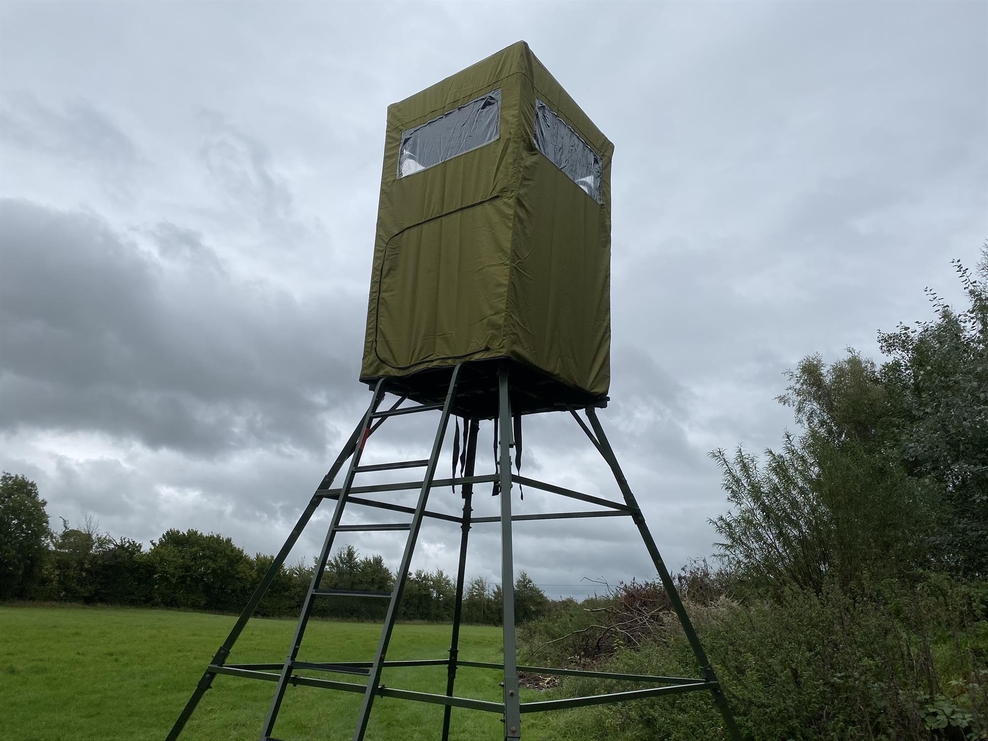 Dale covered double free-standing high seat hunting tower with water-resistant cover, enclosed and elevated for hunting visibility.