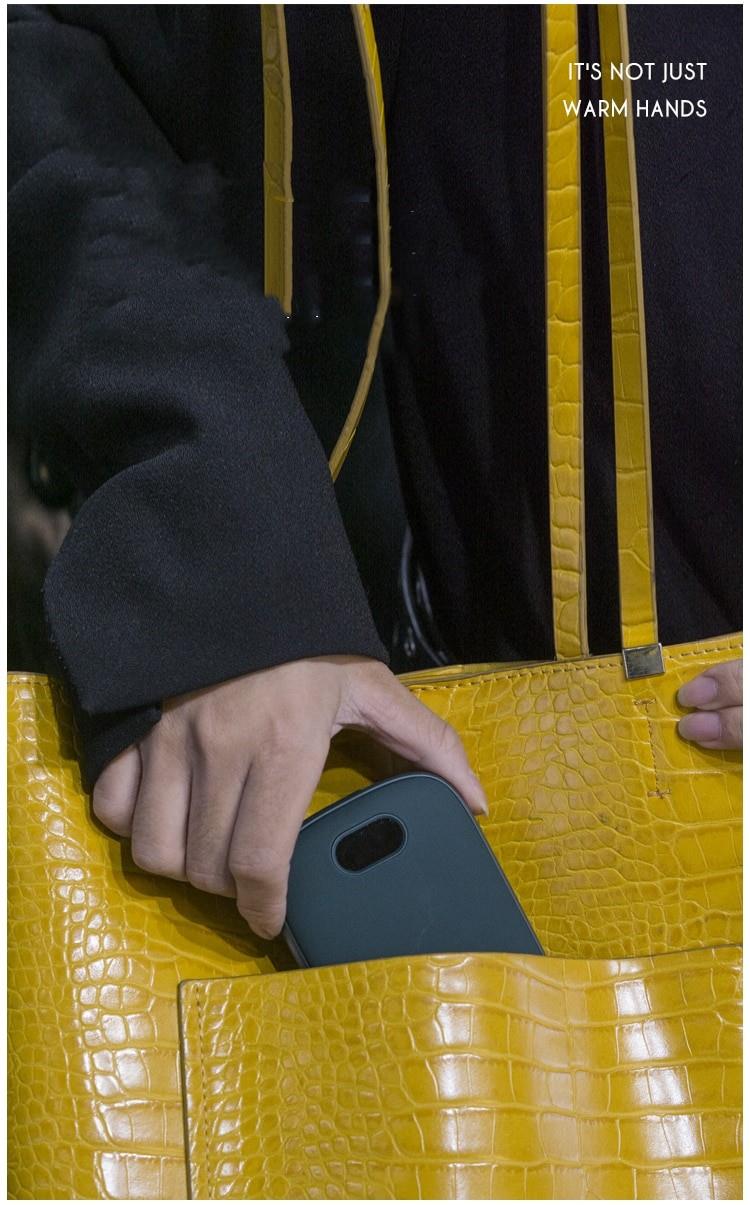 Double-sided digital hand warmer by AliExpress showing a sleek, portable design with digital controls and warming surfaces.