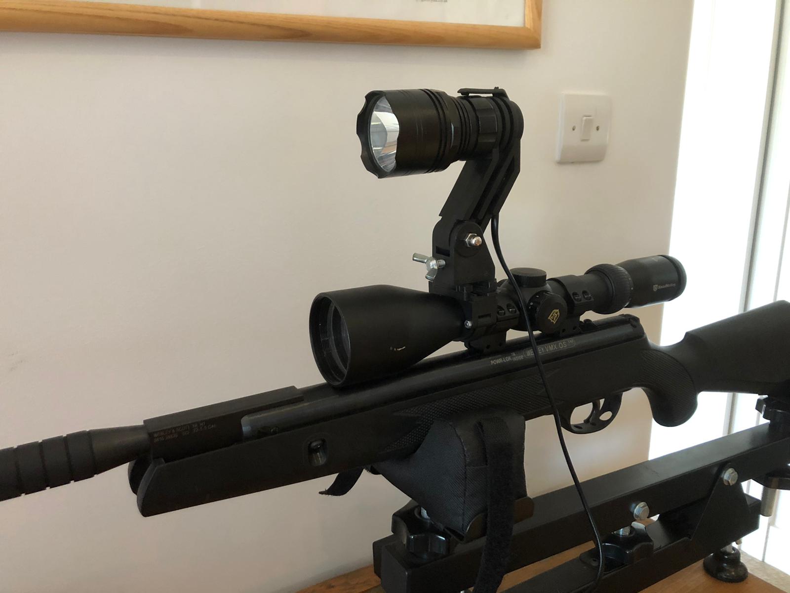 Handheld and scope-mounted LED CREE T6 hunting torch kit by MONICA, featuring a bright LED flashlight and scope attachment for outdoor use.