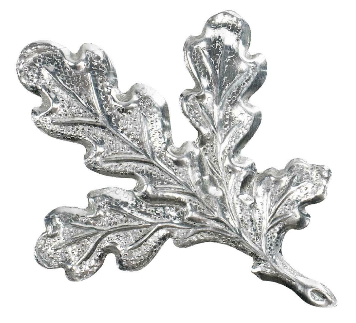 Silver, bronze, or gold leaf for trophy plates by SPJAGD, showcasing shiny metallic leaf accents on a trophy plate.