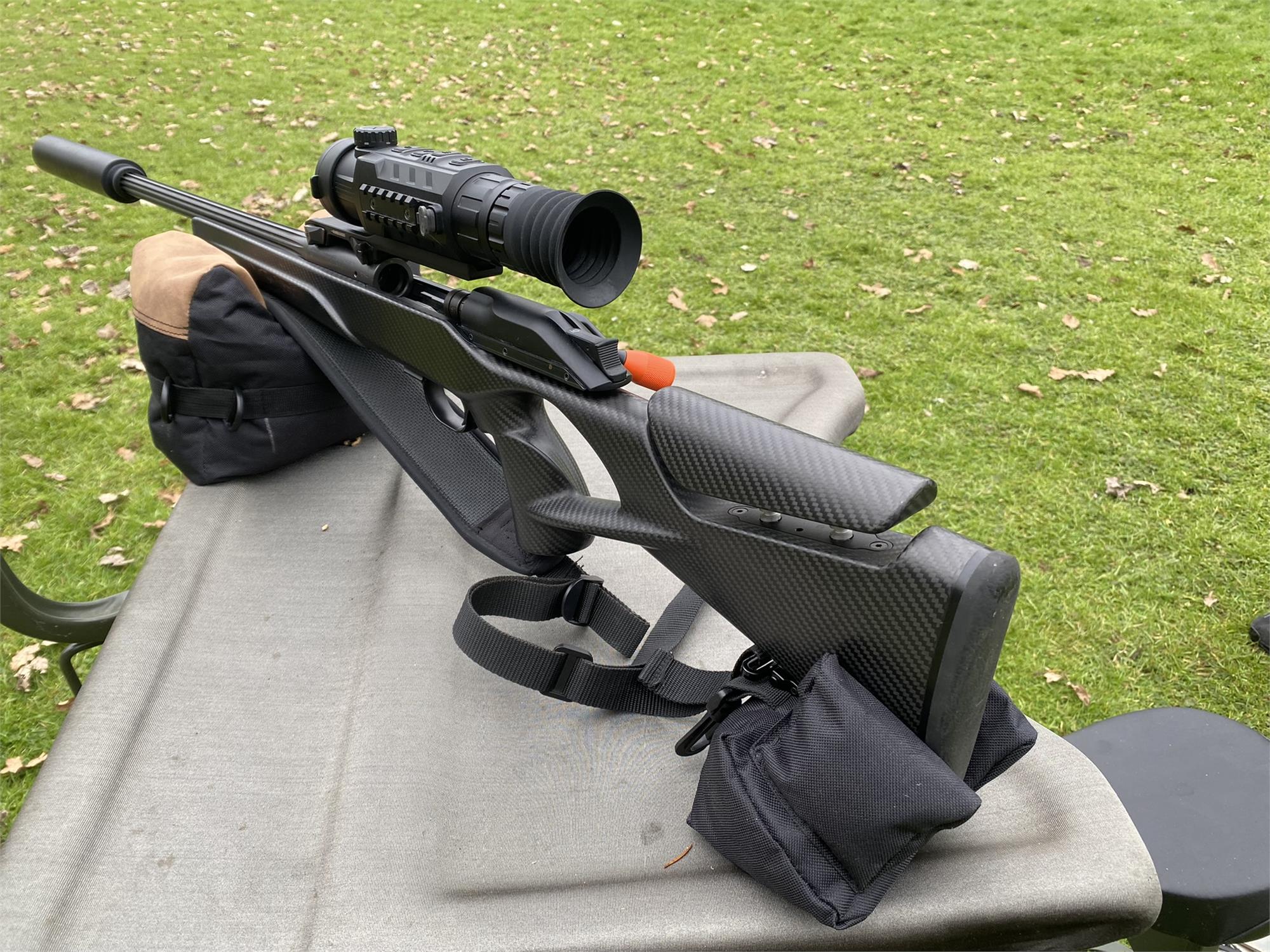 Black and brown two-piece rifle rest by Simon, unfilled, with padded support and adjustable features for firearm stability.