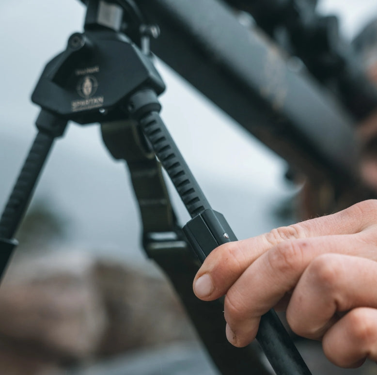 ELITE Spartan ProHunt TAC standard length bipod with adjustable legs, mounted on a firearm for stability during shooting.