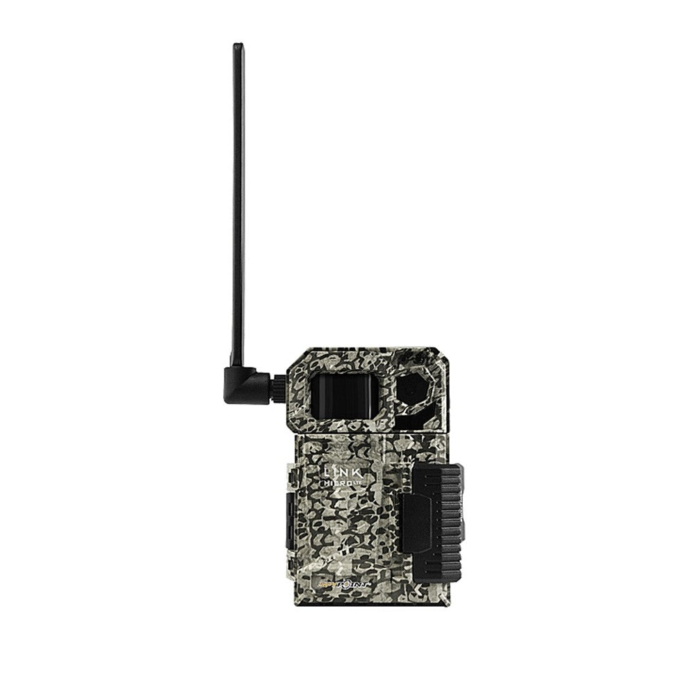 TJACKS LINK MICRO LTE Spypoint trail camera shown with outdoor wildlife view, compact design, and LTE connectivity.