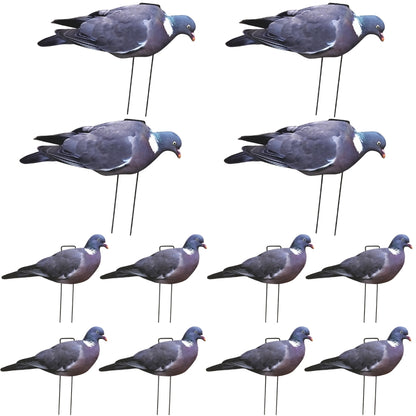 Multiple pigeon decoys on stands arranged in a grid pattern.