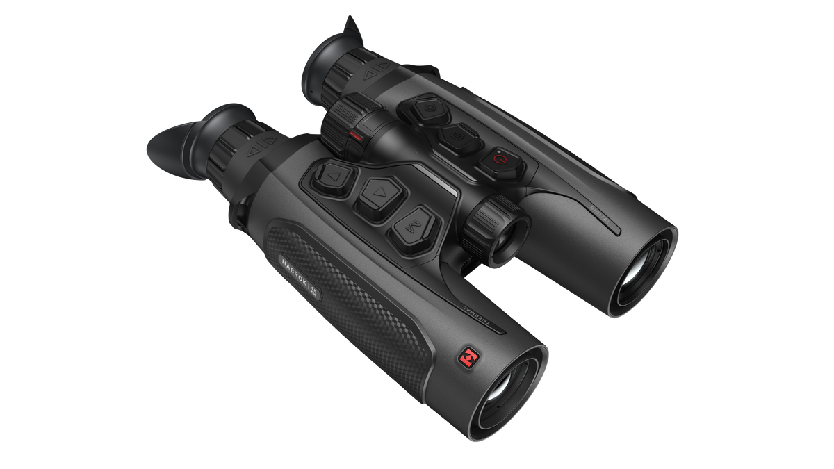 ELITE Habrok 4K HH35L 2.0 thermal binoculars showing dual eyepieces and thermal imaging display in a natural outdoor setting