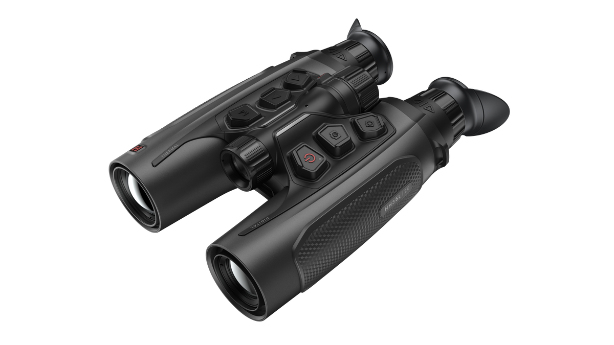 ELITE Habrok 4K HH35L 2.0 thermal binoculars showing dual eyepieces and thermal imaging display in a natural outdoor setting.
