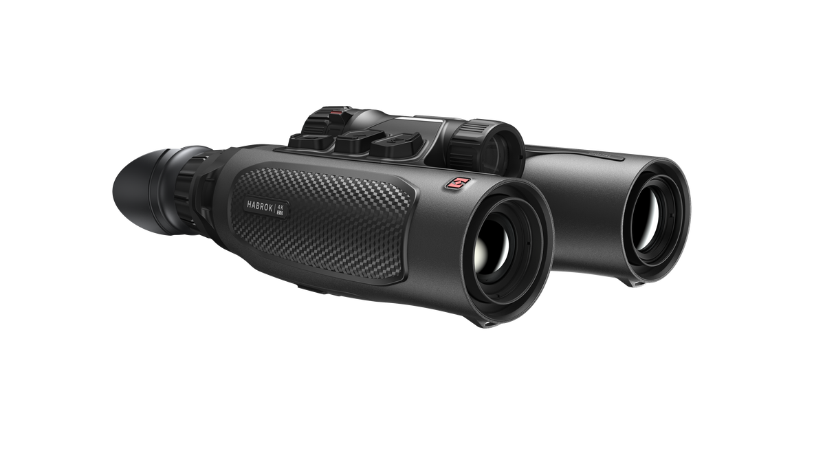 ELITE Habrok 4K HH35L 2.0 thermal binoculars showing dual eyepieces and thermal imaging display in a natural outdoor setting.