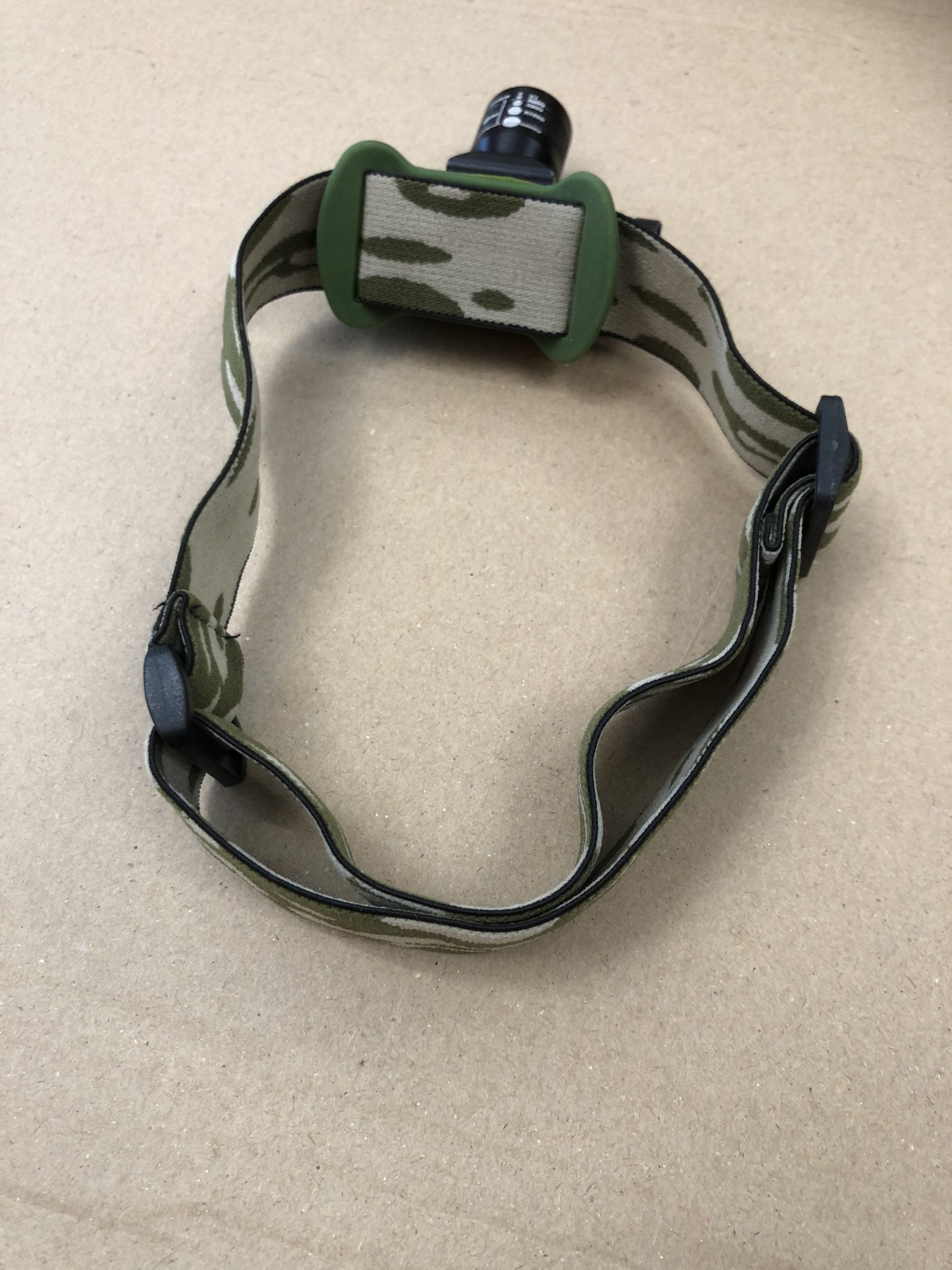 A1 Decoy Slight Seconds Camo Cree rechargeable head torch with adjustable strap, bright LED light, and camouflage design.