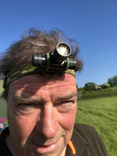 A1 Decoy Slight Seconds Camo Cree rechargeable head torch with adjustable straps and bright LED light for outdoor activities.
