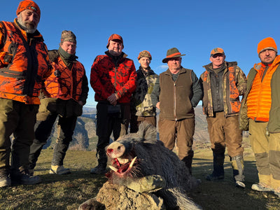 A1 DECOY LTD driven wild boar hunting in Turkey with hunters and hunting gear in a forest setting.