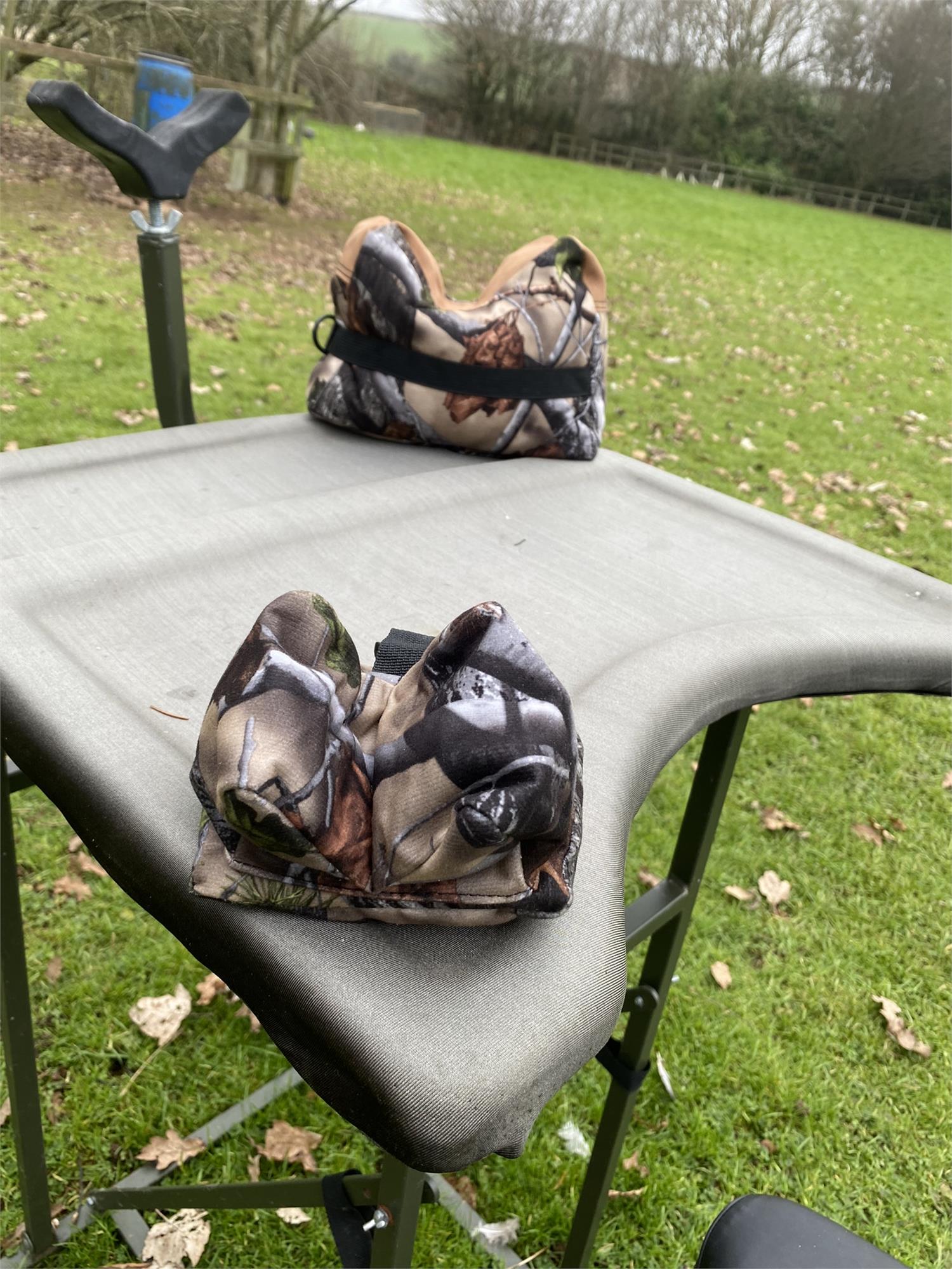 Camo two-piece rifle rest set by A1 Decoy Ltd with adjustable supports for stable firearm positioning.