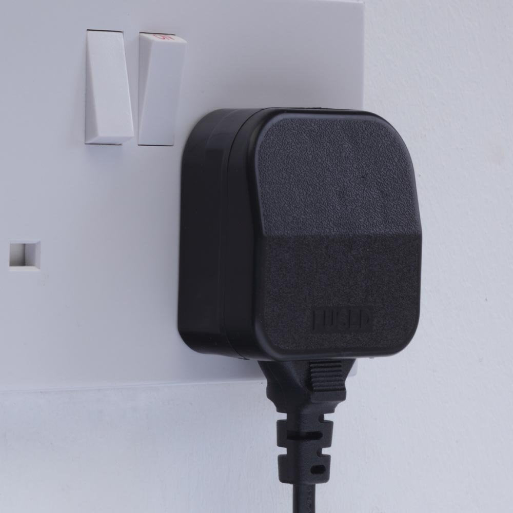 European to UK plug adaptor converter by AliExpress, showing the compact device with European and UK plug sockets.