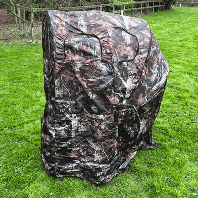 Dale 1-man pop-up hide tent set up outdoors, lightweight and portable for camping or hunting, with camouflage pattern and easy setup