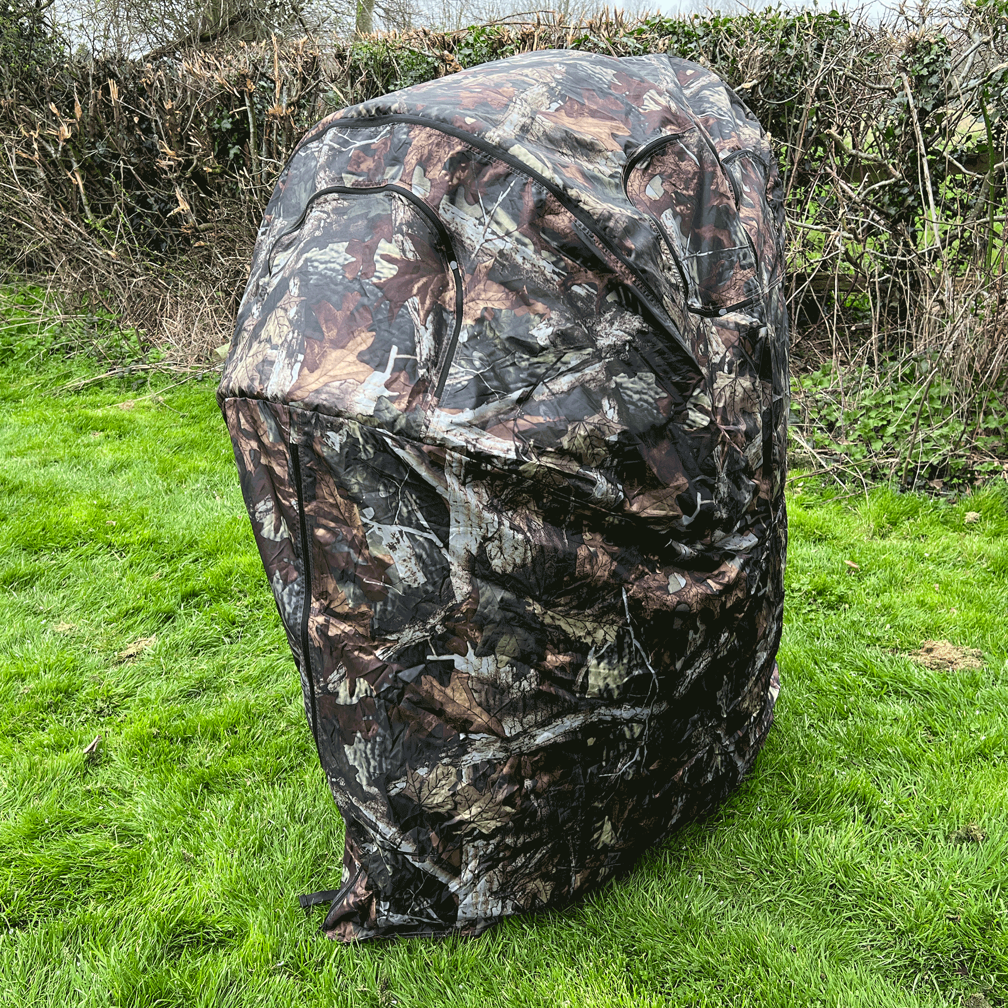 Dale 1-man pop-up hide tent set up outdoors, lightweight and portable for camping or outdoor activities.
