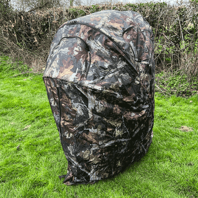 Dale 1-man pop-up hide tent set up outdoors, lightweight and portable for camping or outdoor activities.