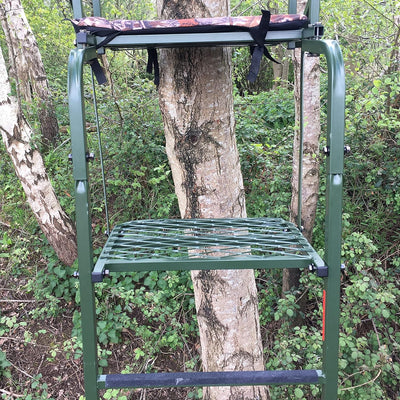 Galvanized adjustable high-seat hunting tree stand from DALE, featuring a sturdy frame and secure platform for outdoor wildlife observation.